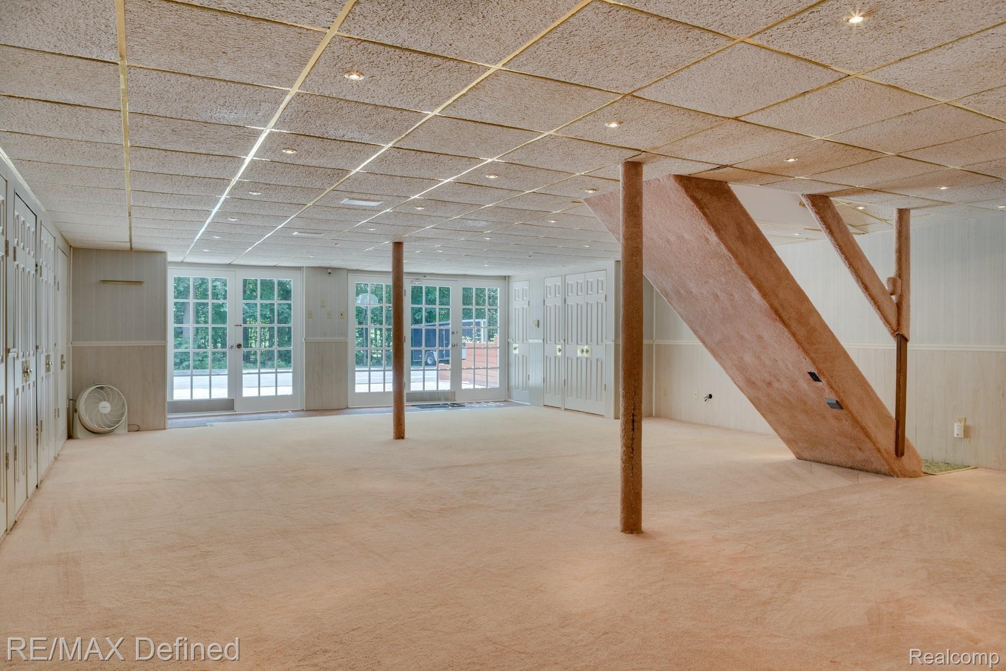 66050 Campground Road Washington, MI 48095 - Photo 26 of 31 Walkout basement with beautiful French doors that let in plenty of light.