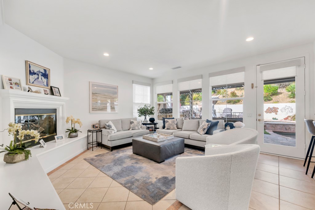 3049 Heavenly Ridge Street Thousand Oaks, CA 91362 - Photo 23 of 50 a living room with fireplace furniture and a large window