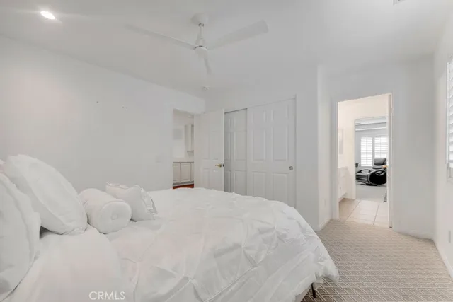 a large white bed in a white room