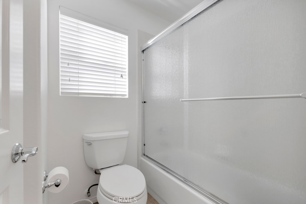 3049 Heavenly Ridge Street Thousand Oaks, CA 91362 - Photo 36 of 50 a white toilet sitting next to a bath tub