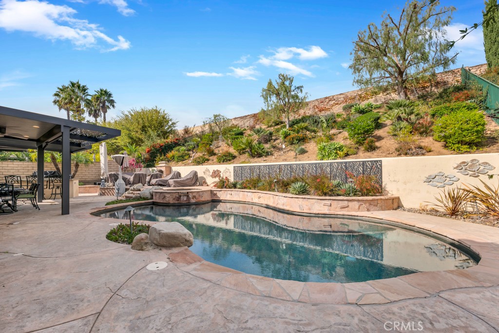 3049 Heavenly Ridge Street Thousand Oaks, CA 91362 - Photo 43 of 50 a view of swimming pool with outdoor seating and plants