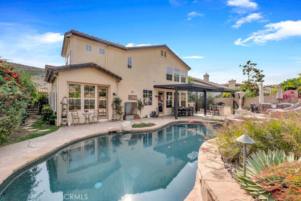 3049 Heavenly Ridge Street Thousand Oaks, CA 91362 - Photo 44 of 50 a view of a house with swimming pool and sitting area
