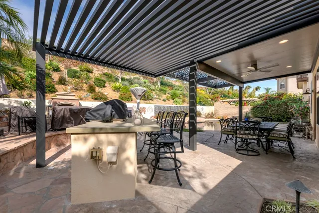a view of dining room with furniture floor to ceiling window and outdoor seating