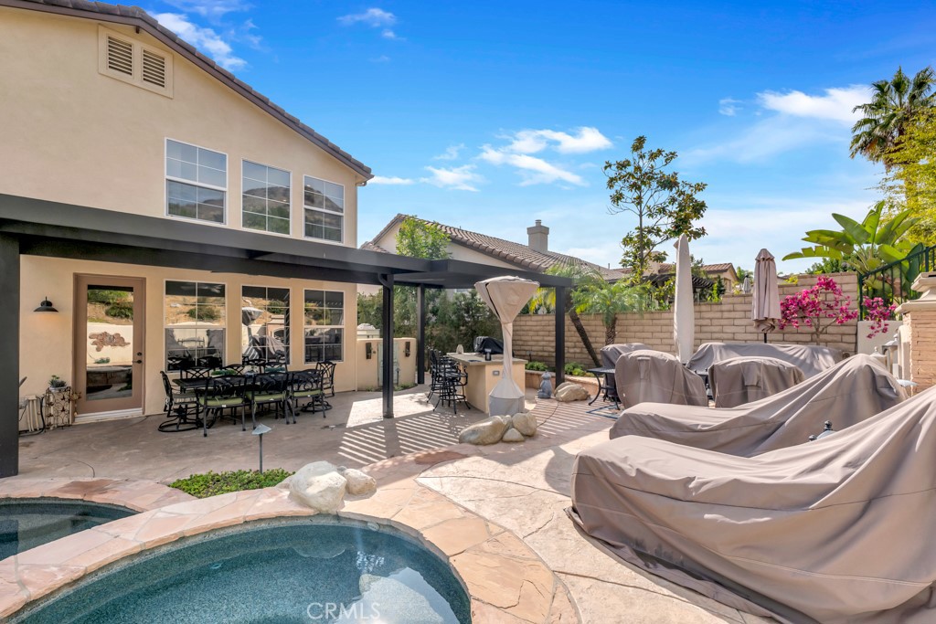 3049 Heavenly Ridge Street Thousand Oaks, CA 91362 - Photo 50 of 50 a view of a patio with couches table and chairs and potted plants