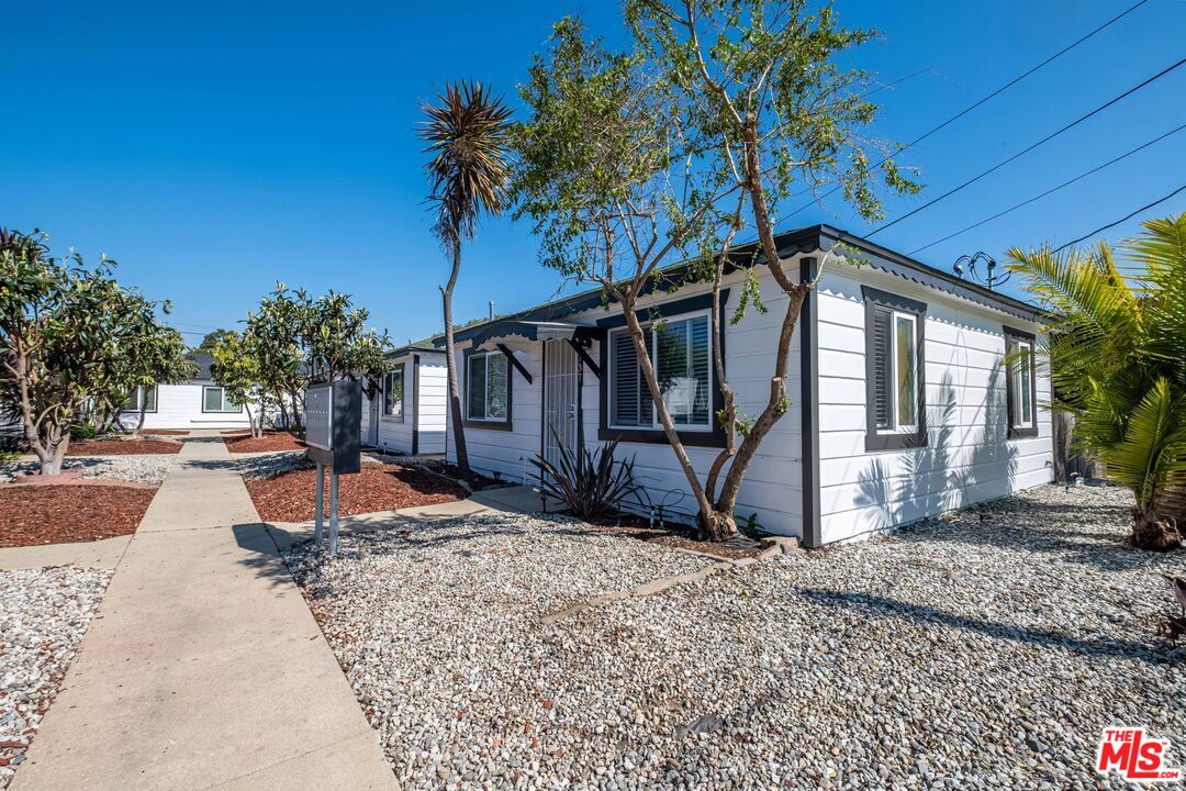 1737 252nd Street Lomita, CA 90717 - Photo 8 of 29 a front view of a house with garden