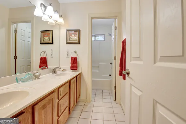 a bathroom with a sink vanity and a mirror