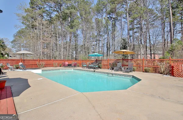 a view of a swimming pool with a lounge chair