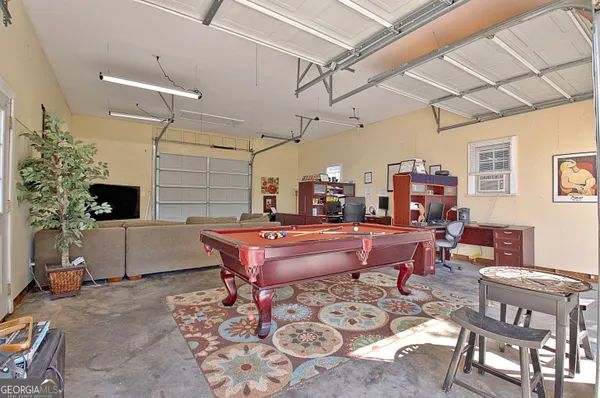 a reading room with furniture and a fireplace