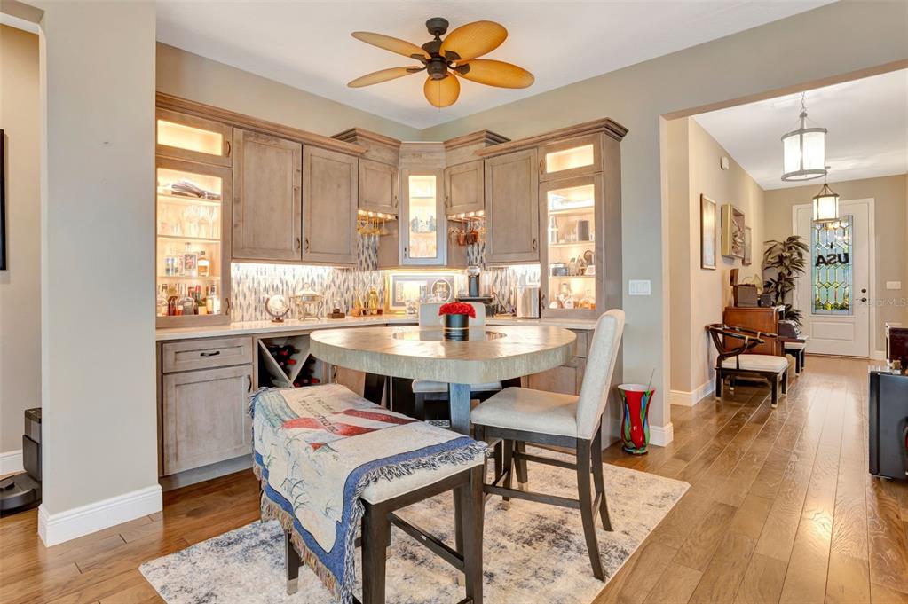 176 Silver Maple Road Groveland, FL 34736 - Photo 14 of 45 a dining room with a wooden table and chairs