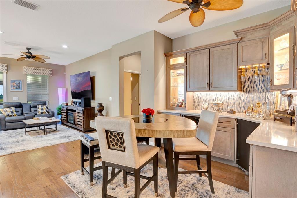 176 Silver Maple Road Groveland, FL 34736 - Photo 15 of 45 a view of a dining room with furniture and a window