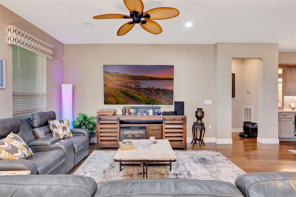 176 Silver Maple Road Groveland, FL 34736 - Photo 17 of 45 a living room with furniture and a flat screen tv