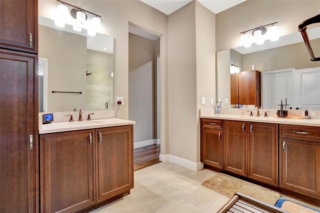 176 Silver Maple Road Groveland, FL 34736 - Photo 23 of 45 a bathroom with a sink vanity and mirror