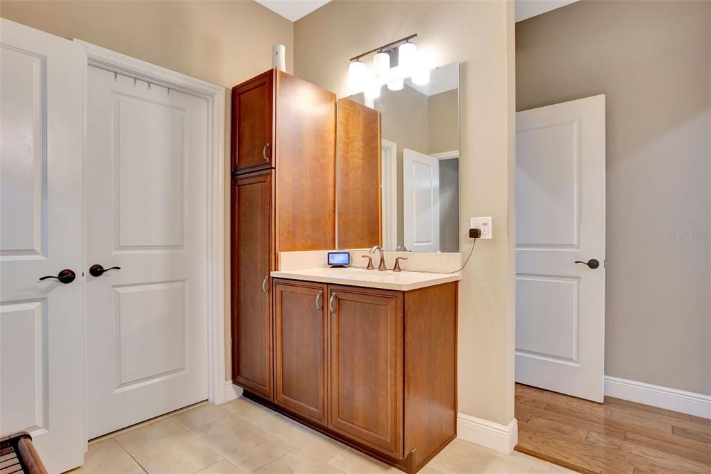 176 Silver Maple Road Groveland, FL 34736 - Photo 25 of 45 a bathroom with a double vanity sink and a mirror