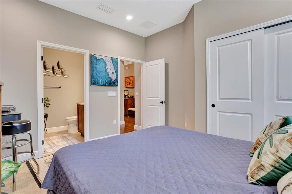 176 Silver Maple Road Groveland, FL 34736 - Photo 27 of 45 a bedroom with a bed and a view of bedroom