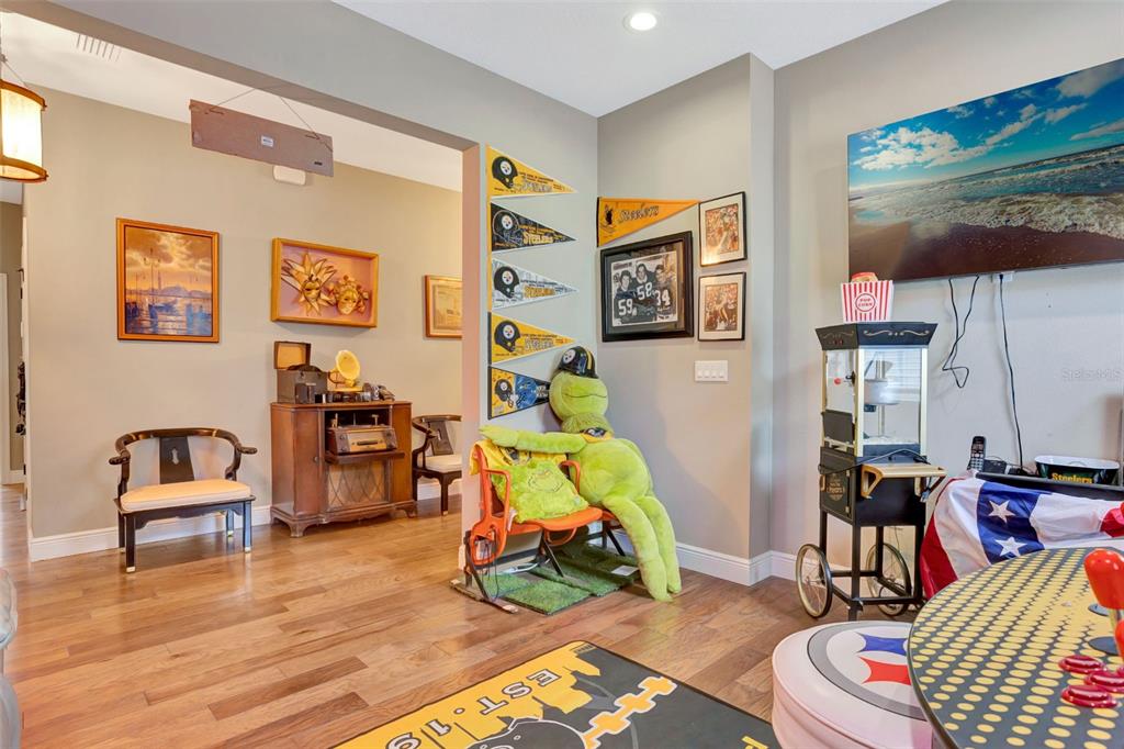 176 Silver Maple Road Groveland, FL 34736 - Photo 30 of 45 a living room with furniture and wooden floor