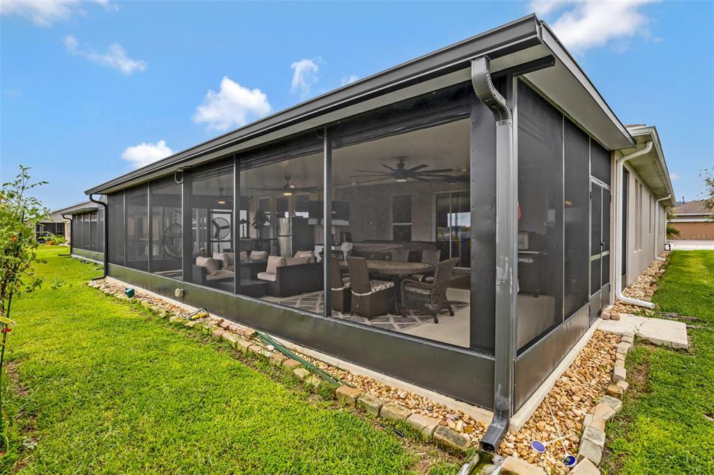 176 Silver Maple Road Groveland, FL 34736 - Photo 37 of 45 a front view of a house with a yard