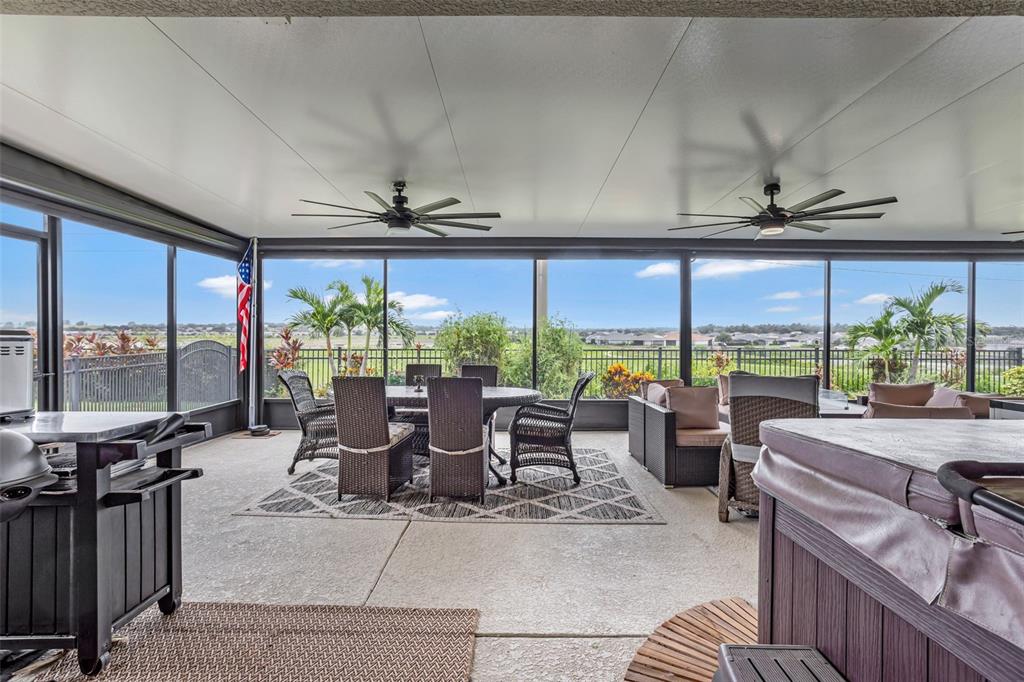 176 Silver Maple Road Groveland, FL 34736 - Photo 6 of 45 a view of a dining room with furniture large windows and wooden floor