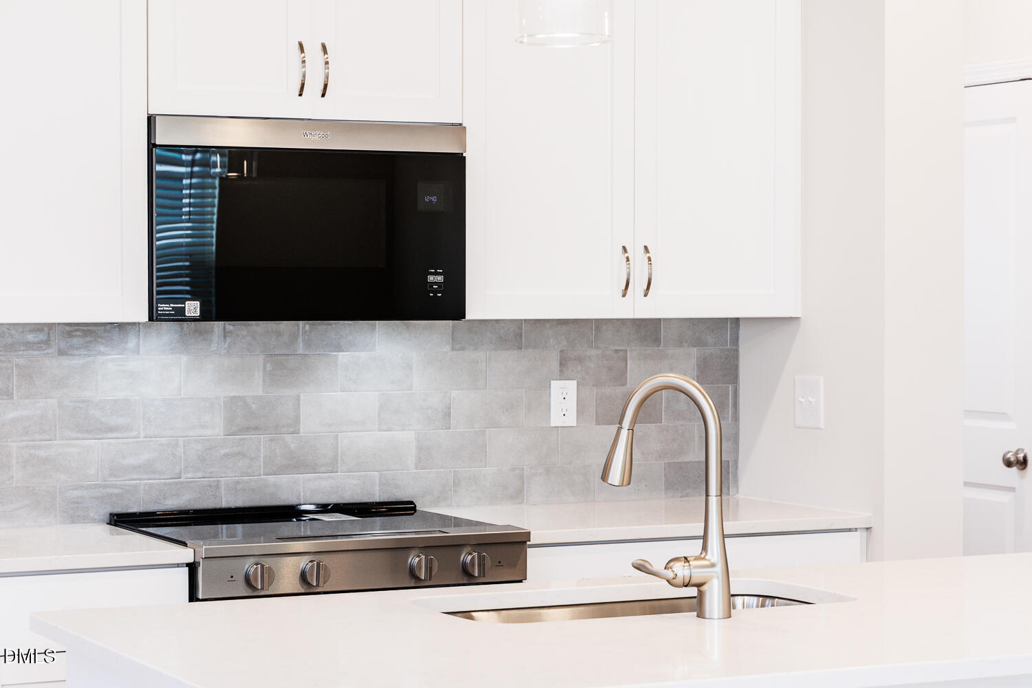 136 Siebold Street Garner, NC 27529 - Photo 16 of 43 a close view of a stove a microwave and cabinets