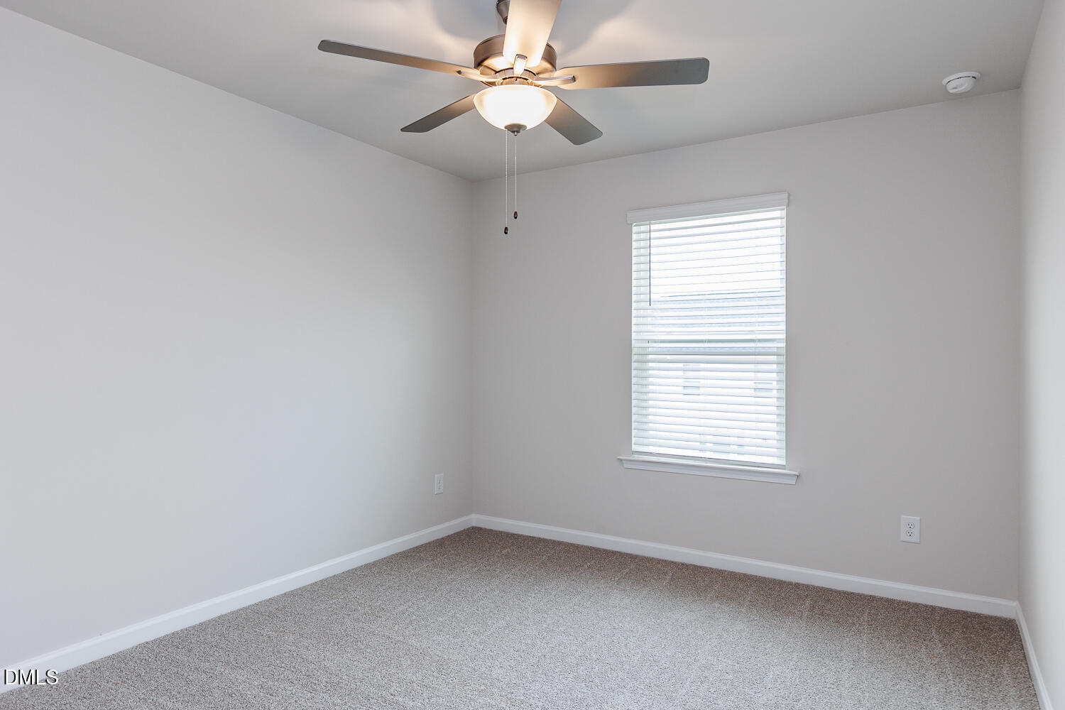 136 Siebold Street Garner, NC 27529 - Photo 28 of 43 an empty room with a window and a fan
