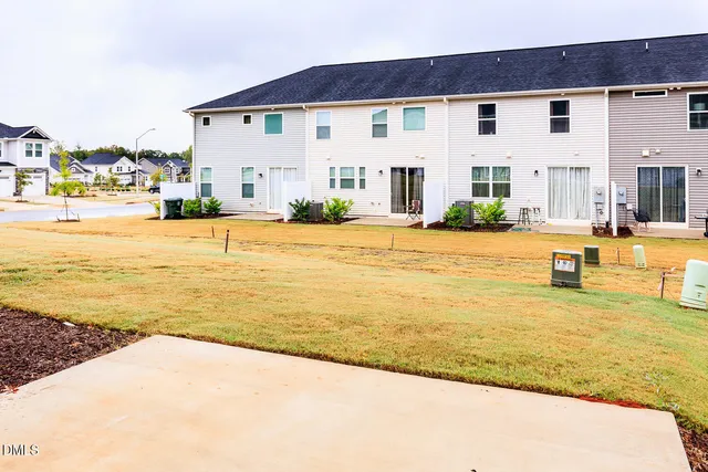 a view of an house with pool and ocean view