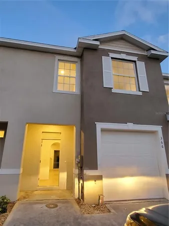 a view of a house with a garage