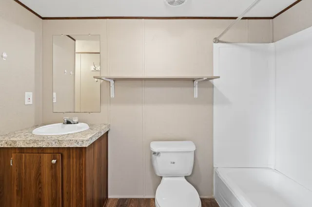 a bathroom with a sink a toilet and a bathtub