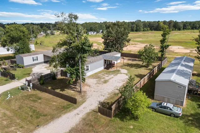 an aerial view of a house with lake view