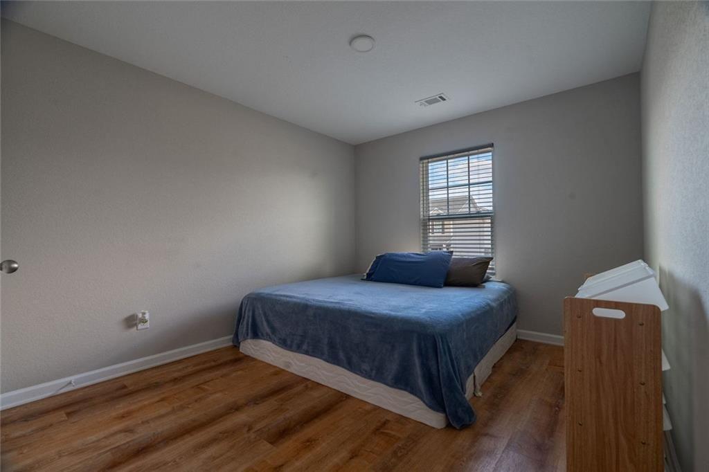 735 Walnut Creek Circle Pendergrass, GA 30567 - Photo 15 of 29 a bedroom with a bed and window