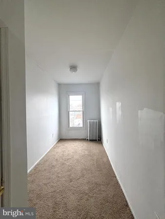a view of hallway with windows