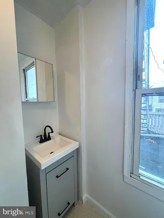 a utility room with sink dryer and washer