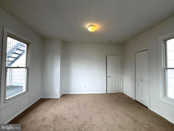 an empty room with windows