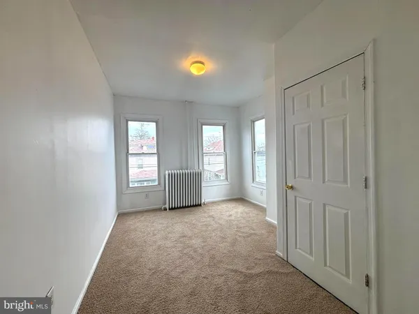 a view of an empty room and window