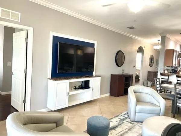 a living room with furniture and a flat screen tv