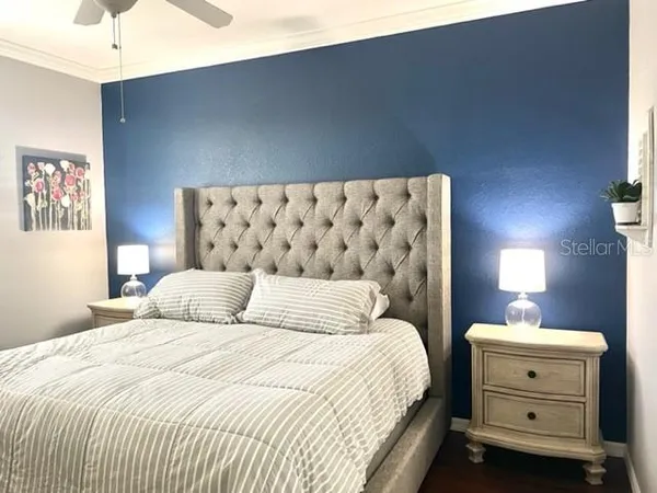 a bedroom with a bed and lamp lamp