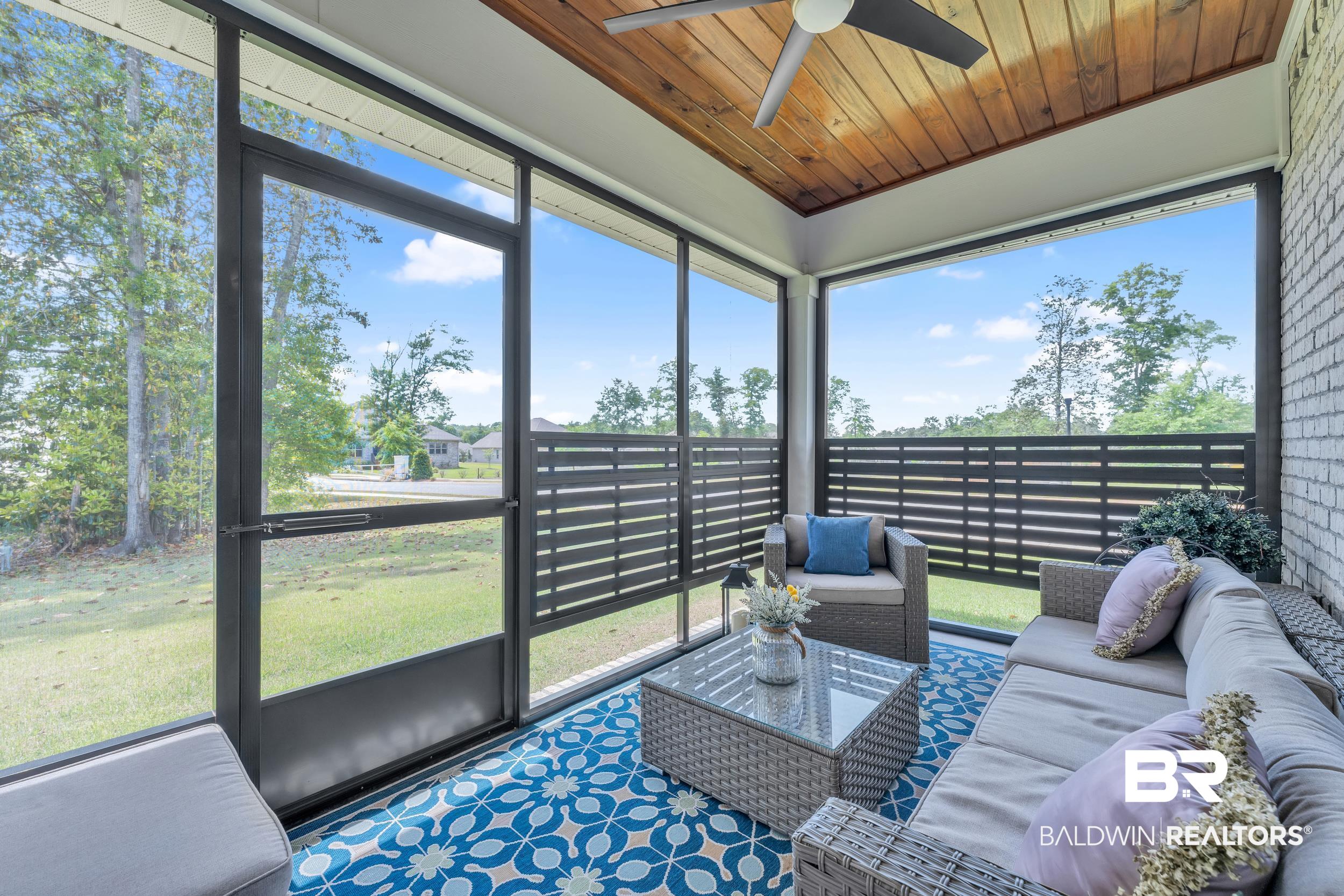 31630 Canopy Loop Daphne, AL 36527 - Photo 19 of 30 Sunroom with ceiling fan and an outdoor hangout area