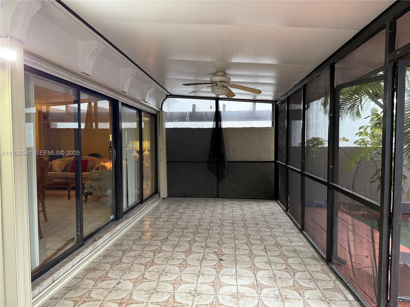 9901 Northwest 9th St Circle, Unit 32 Miami, FL 33172 - Photo 13 of 14 a bathroom with a glass door