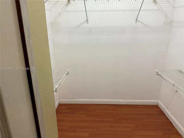 a view of small space with empty racks on the wall