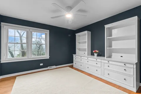 a bed room with a bed and a dresser