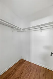 a view of a room with shelf on the wall