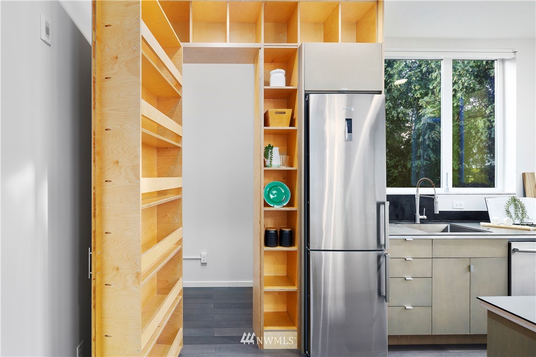 1623 14th Avenue, Unit E Seattle, WA 98122 - Photo 12 of 40 a kitchen with a refrigerator and countertop