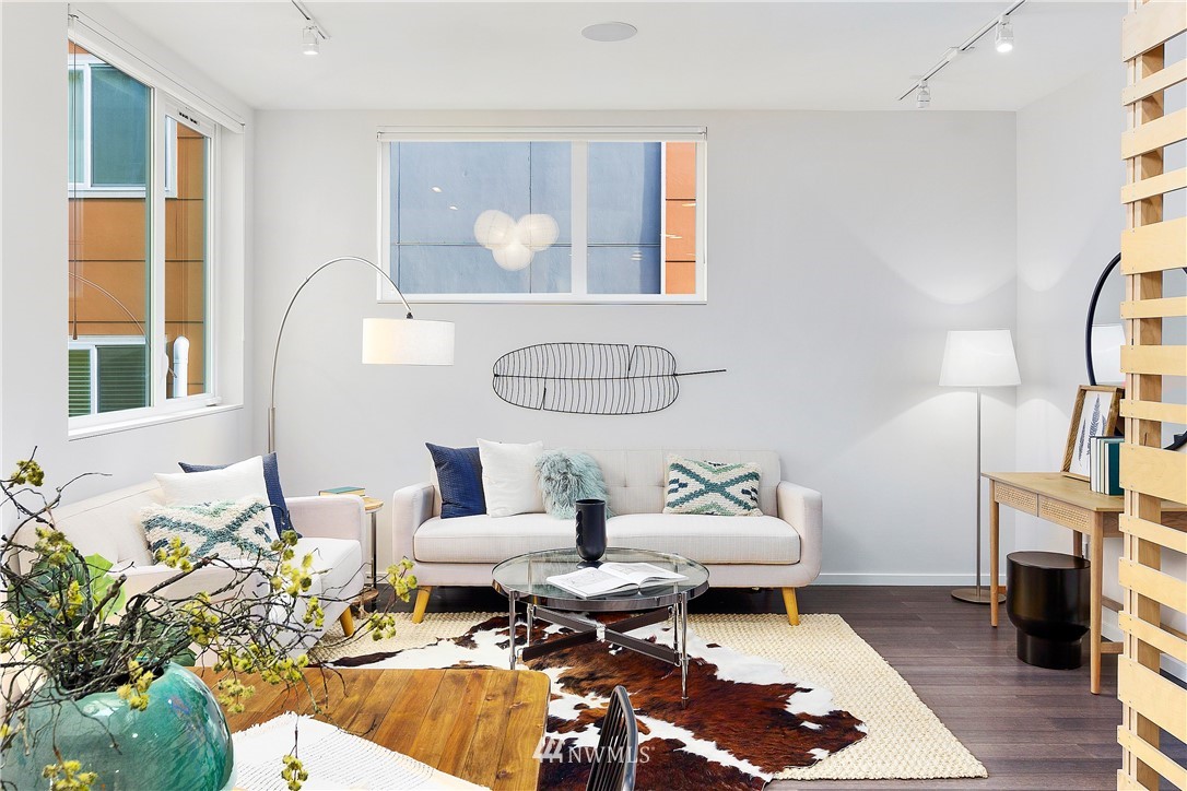 1623 14th Avenue, Unit E Seattle, WA 98122 - Photo 16 of 40 a living room with fireplace furniture and a window