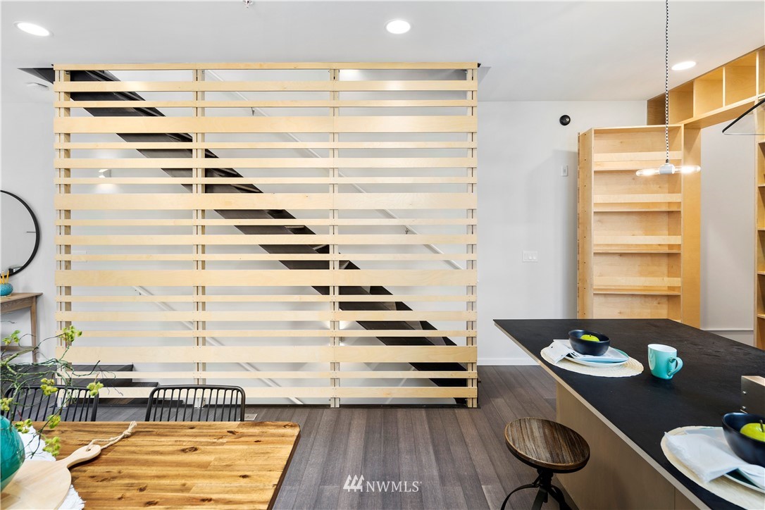 1623 14th Avenue, Unit E Seattle, WA 98122 - Photo 17 of 40 a view of a dining room with furniture and wooden floor