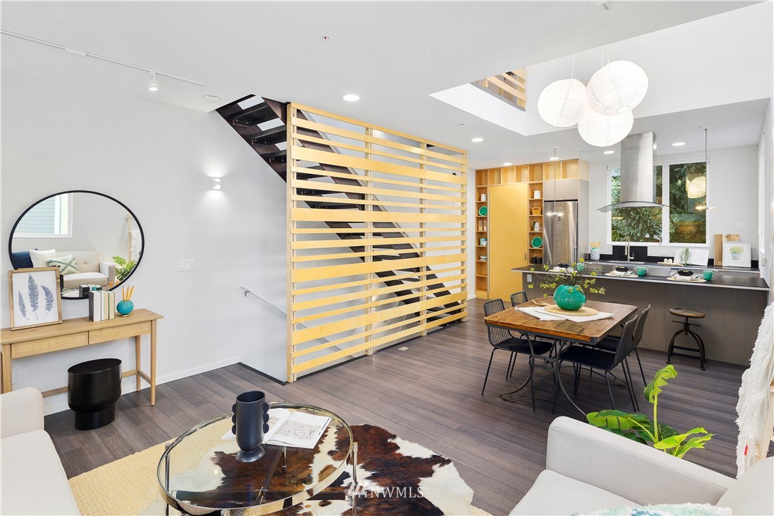 1623 14th Avenue, Unit E Seattle, WA 98122 - Photo 19 of 40 a living room with furniture and a fireplace