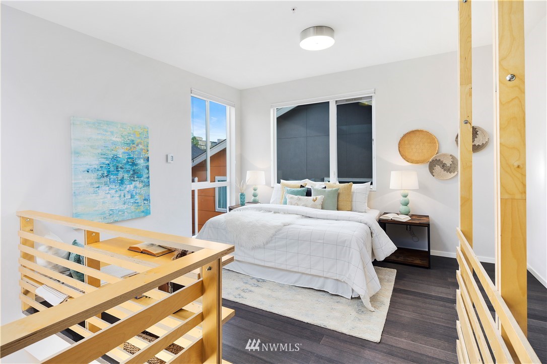 1623 14th Avenue, Unit E Seattle, WA 98122 - Photo 22 of 40 a bedroom with a bed and a dresser