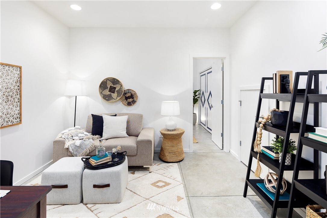 1623 14th Avenue, Unit E Seattle, WA 98122 - Photo 4 of 40 a living room with furniture and a book shelf