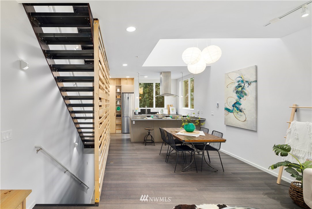 1623 14th Avenue, Unit E Seattle, WA 98122 - Photo 9 of 40 a living room with furniture and wooden floor