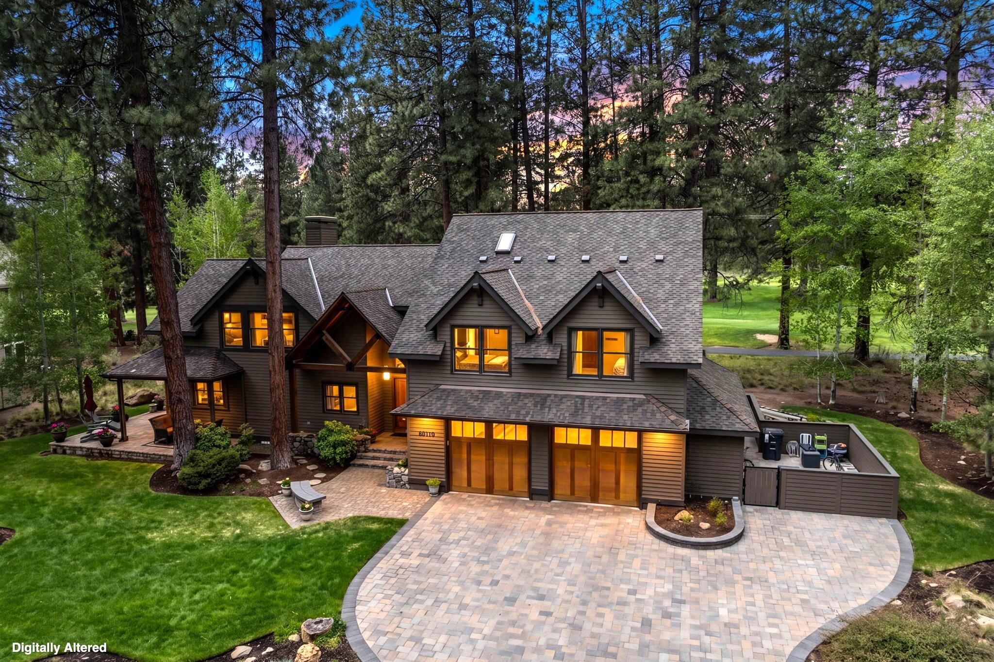 an aerial view of a house with swimming pool and big yard