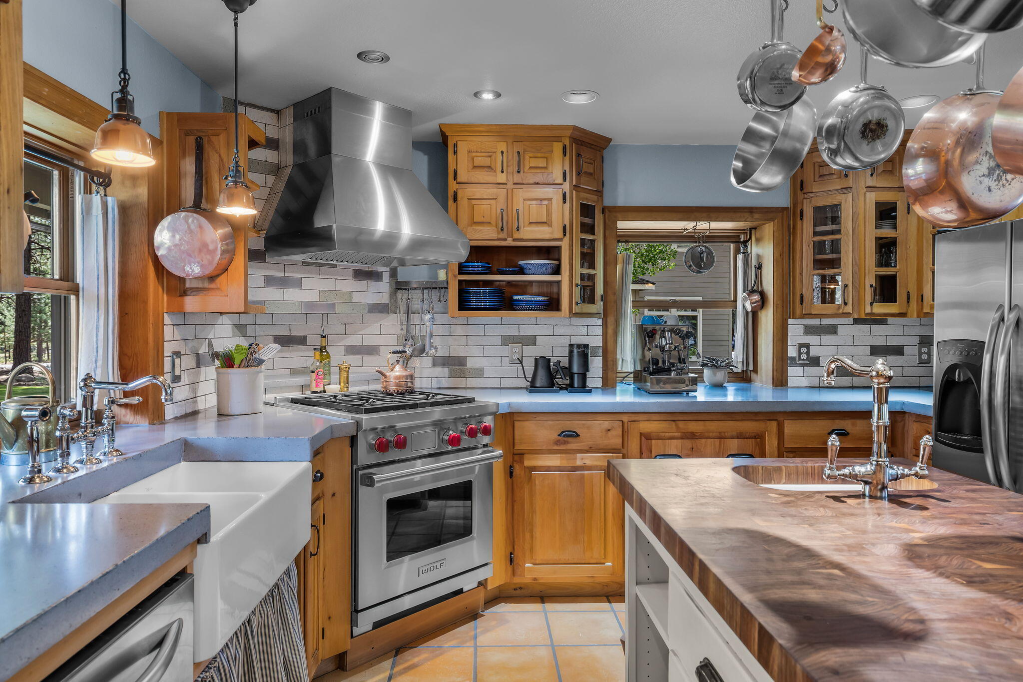 60779 Currant Way Bend, OR 97702 - Photo 15 of 63 a kitchen with stainless steel appliances granite countertop a stove and cabinets