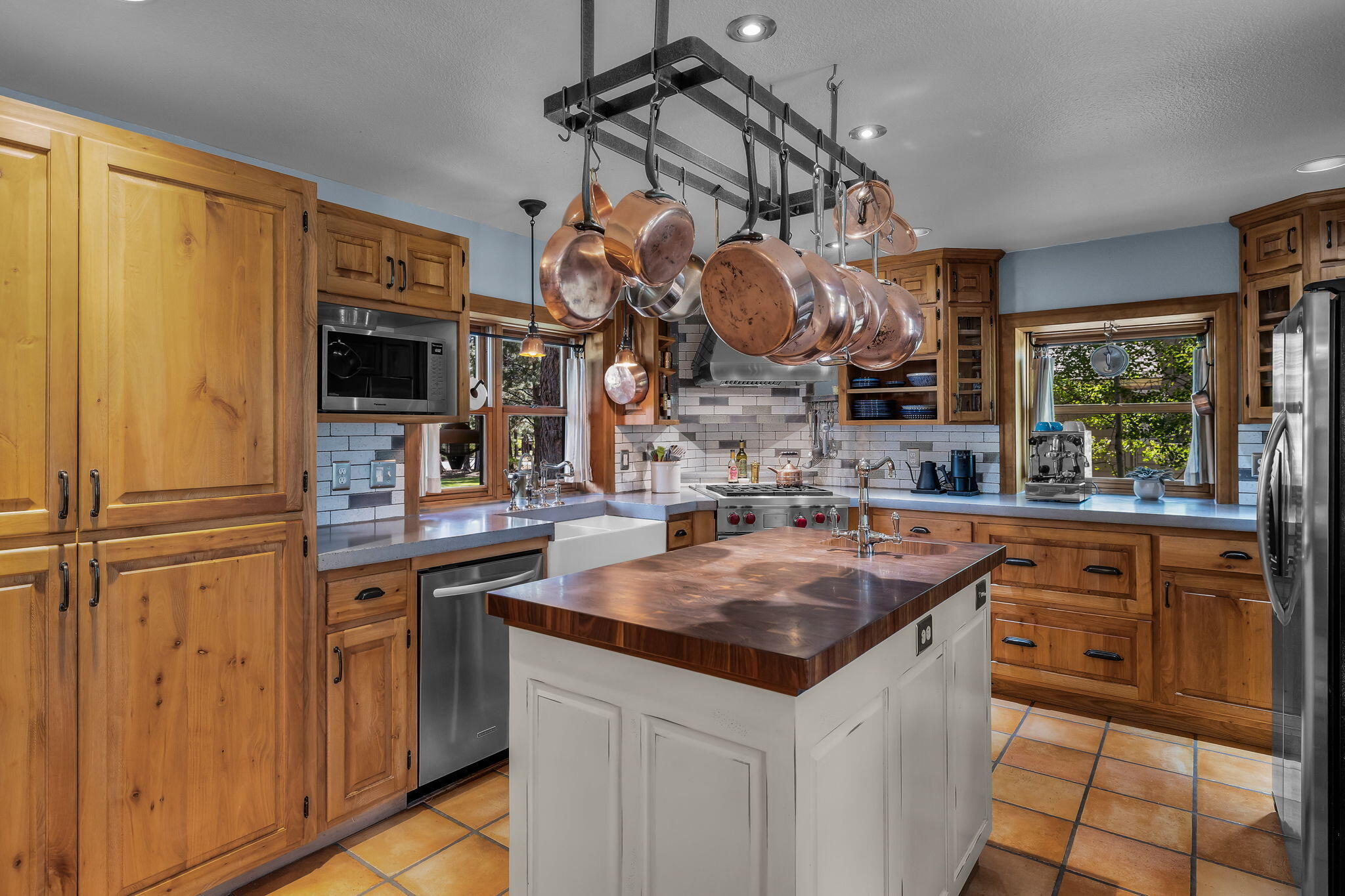60779 Currant Way Bend, OR 97702 - Photo 17 of 63 a kitchen with a sink a counter space cabinets and appliances