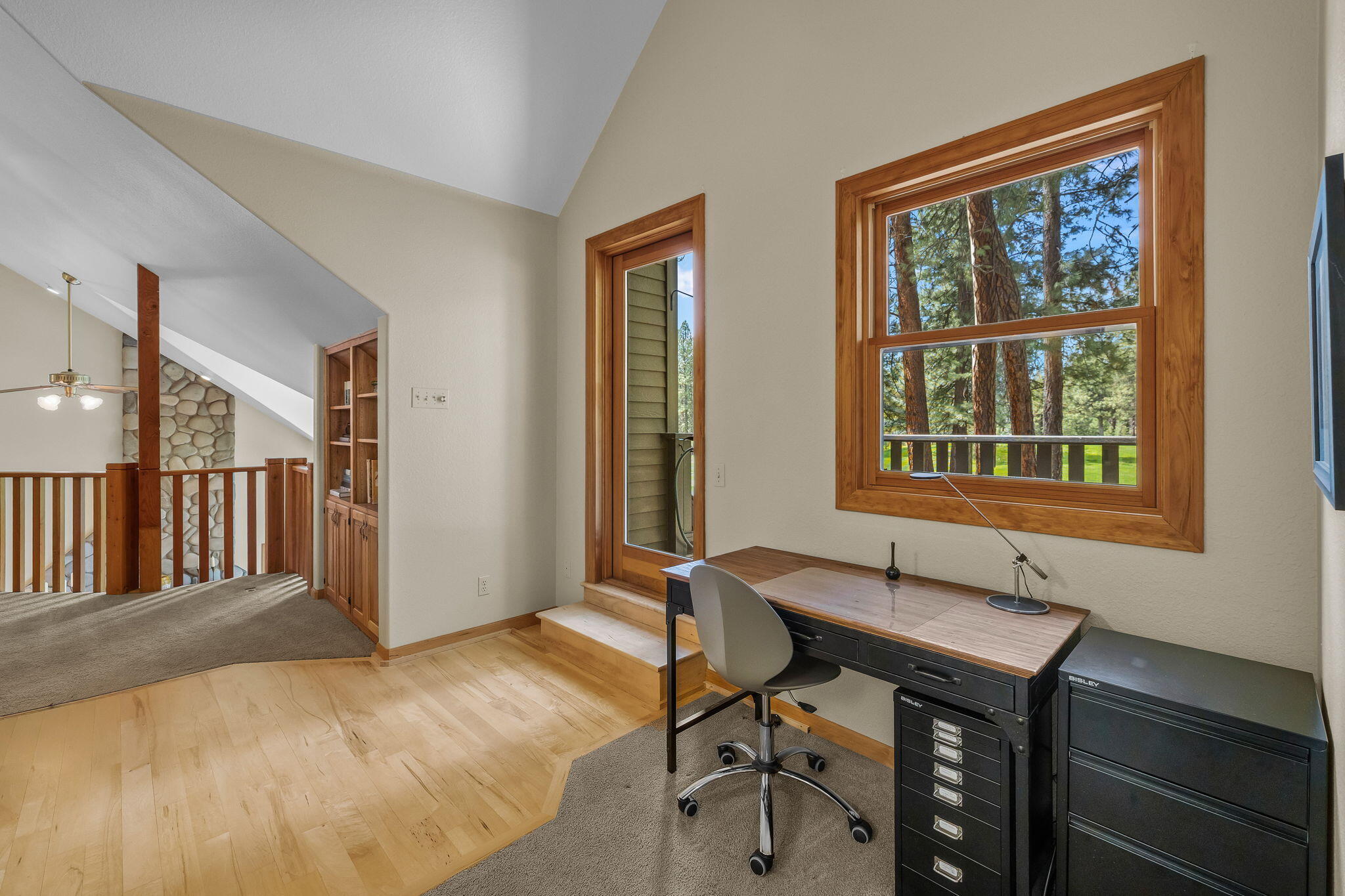 60779 Currant Way Bend, OR 97702 - Photo 31 of 63 a view of a workspace with furniture and a window